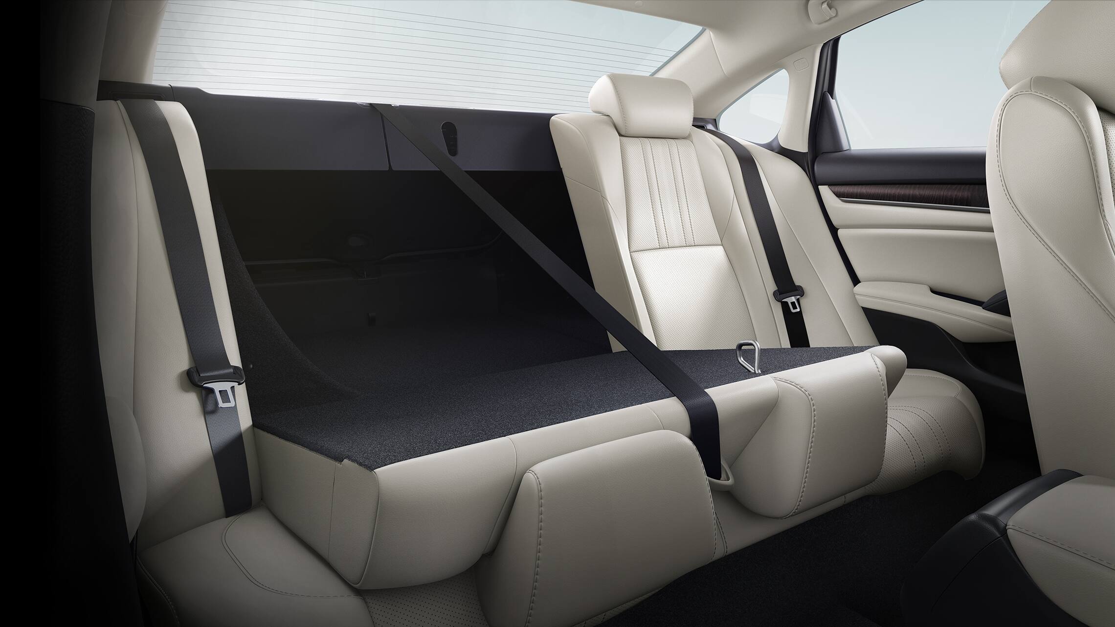 60/40 split fold-down rear seatback detail, shown partly folded down, in the 2021 Honda Accord Touring 2.0T with Ivory Leather.